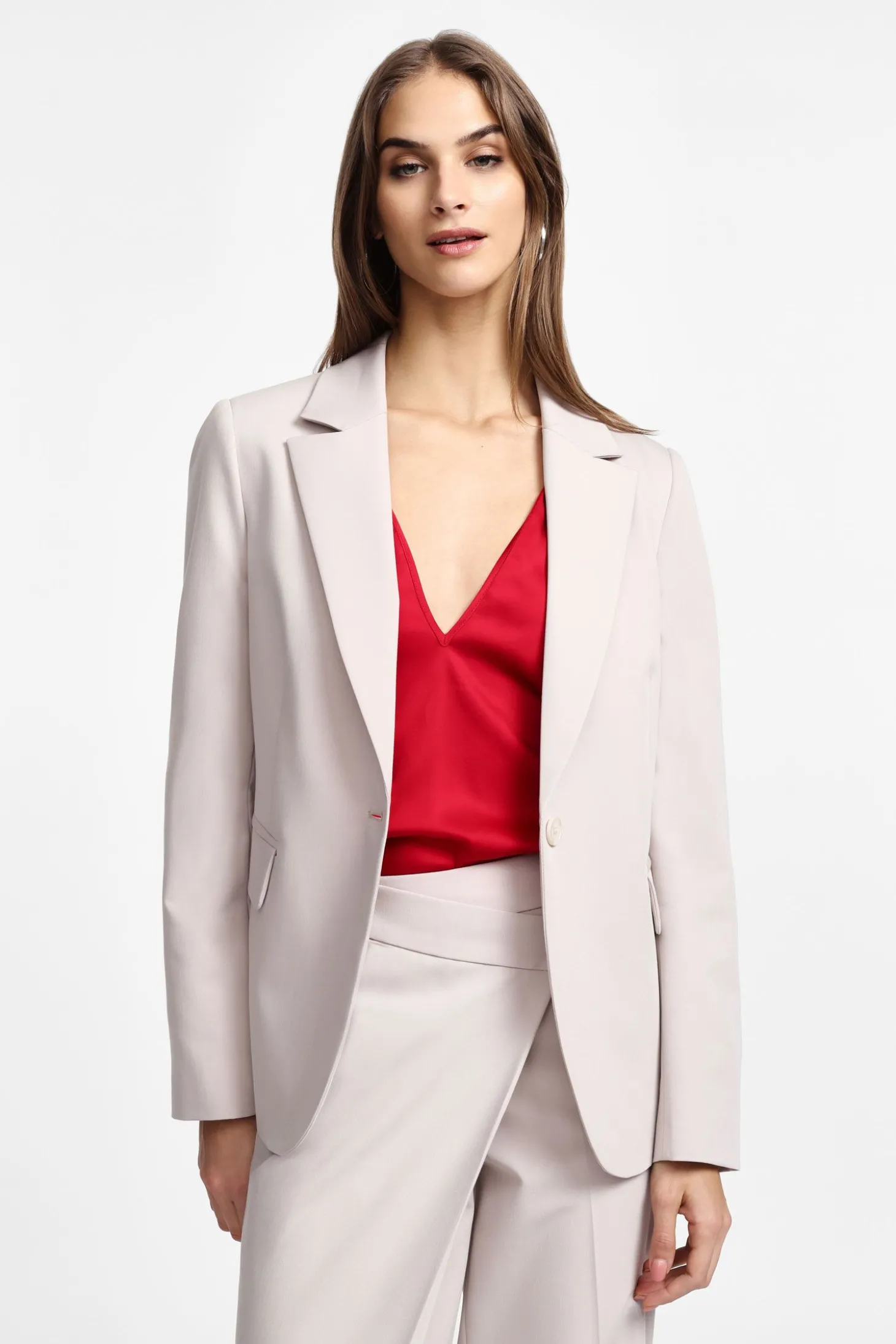 Blazer con bottone e tasche a pattina