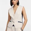 Gilet bicolor con bottoni e tasche