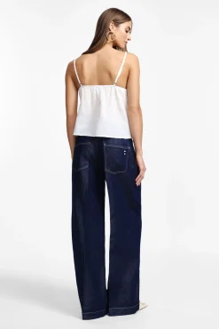 Jeans a gamba larga con vita alta e piega