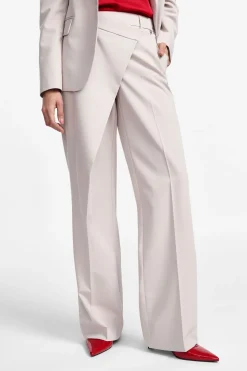 Pantaloni ampi vita alta con chiusura asimmetrica