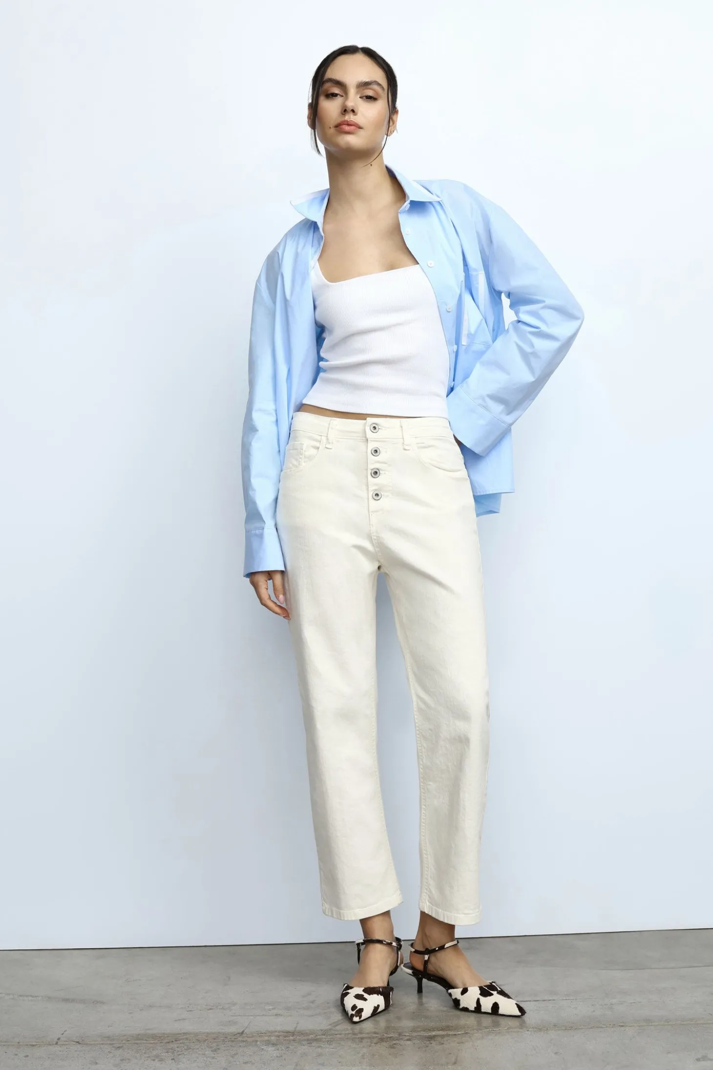 Pantaloni baggy con tasche e bottoni a vista